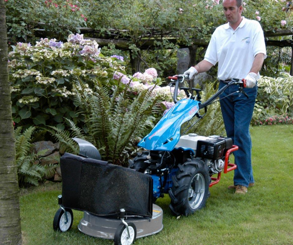 BCS Tractor shown in use with a 22 inch mower attachment