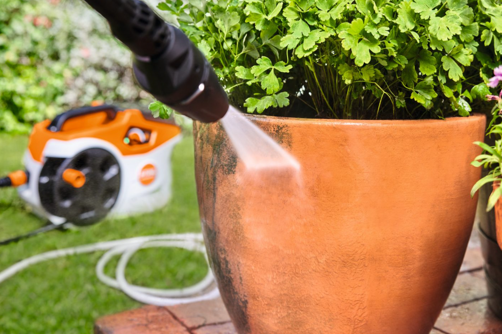Pressure Washing outside pots is easy to do with this battery pressure washer
