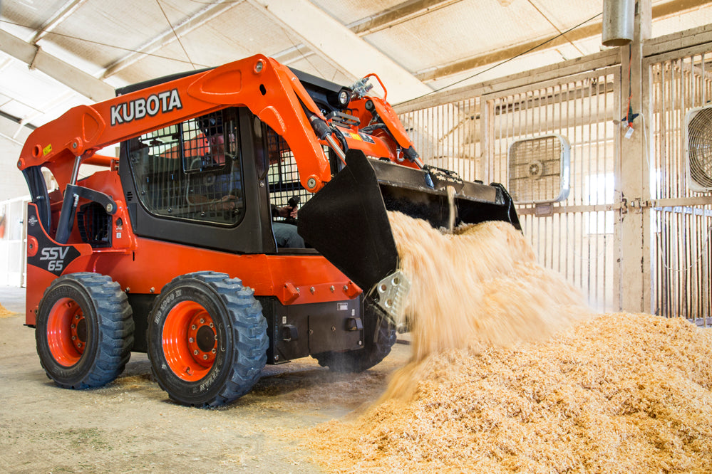 Kubota SSV 65 skid steer in use