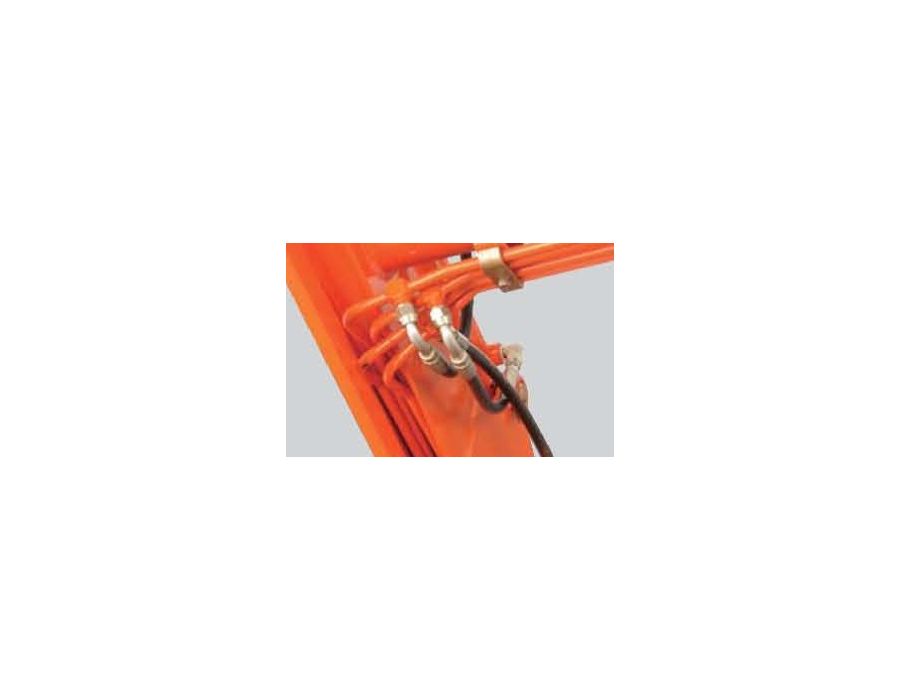 The hydraulic hoses are routed through a recessed area under the loader lift arm for increased protection, longer life, improved visibility, and a cleaner-looking design.